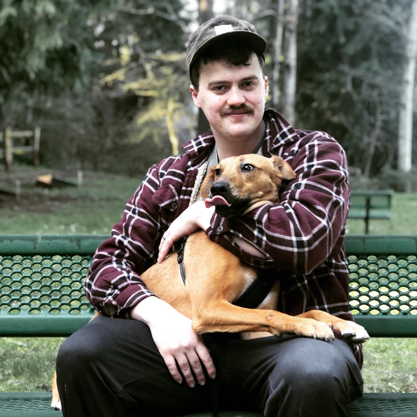 Photo of Ian Kinkead with his dog, a catahoula named Russ.